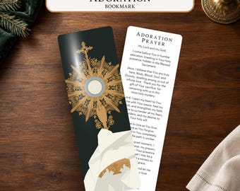 May include: Two rectangular bookmarks featuring religious imagery. One bookmark has a dark background with a gold monstrance illustration. The other is white with black text titled Adoration Prayer, containing a prayer about humble adoration.