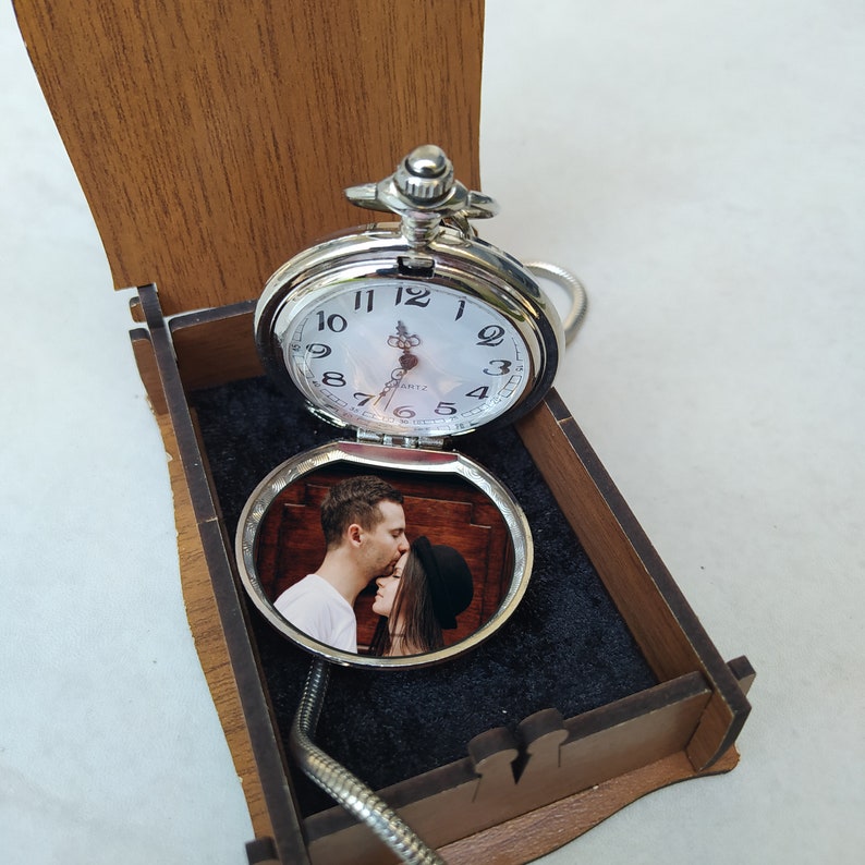 Photo printing on a silver pocket watch.
