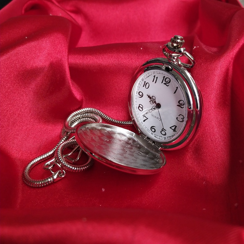 A cute and stylish looking silver pocket watch that you can give to your husband as an anniversary gift
