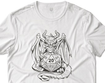 May include: A white t-shirt with a black and white illustration of a dragon holding a twenty-sided die.