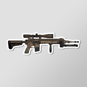May include: A brown and black rifle with a scope attached. The rifle has a black stock and a bipod.