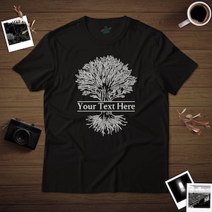 May include: Black t-shirt with a white outline of a tree with roots and the text "Your Text Here" printed on the front.