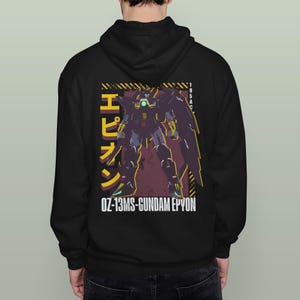 May include: Black hooded sweatshirt featuring a graphic of a Gundam Epyon robot. The design includes Japanese text and the text "OZ-13MS-GUNDAM EPYON" in white. The robot is depicted in shades of purple, yellow, and green.