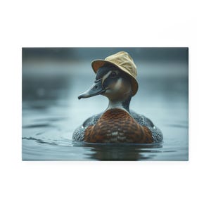 May include: A duck wearing a yellow hat is floating in a body of water. The duck has brown and black feathers and a black beak.