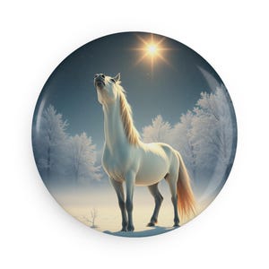 May include: A white horse stands in a snowy forest, looking up at a bright star in the sky.