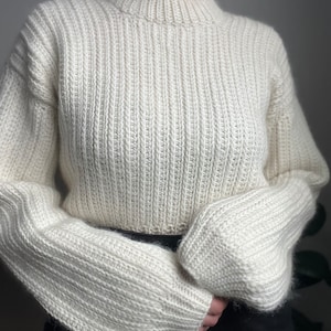 Vintage-inspired beginner-friendly crochet sweater pattern PDF. Uses mock-knit stitches to give a timeless chic look.