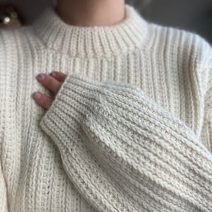 Vintage-inspired beginner-friendly crochet sweater pattern PDF. Uses mock-knit stitches to give a timeless chic look.