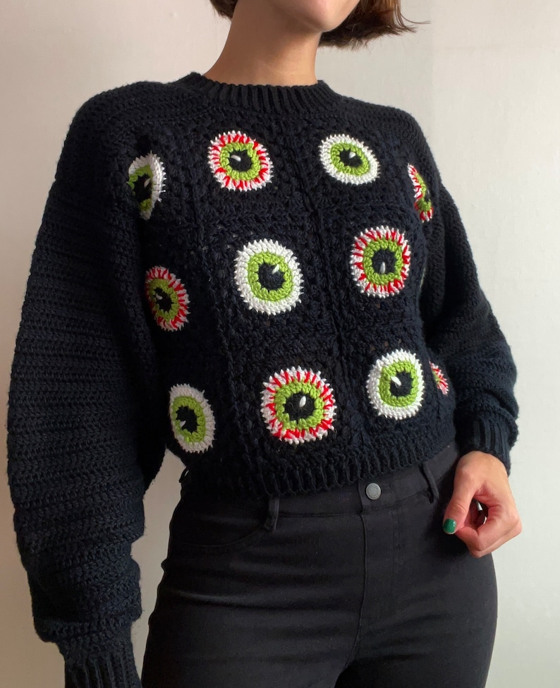 Size inclusive spooky Halloween crochet granny square eyeball sweater. Comes cropped with a relaxed fit and cozy bishop sleeves. Video tutorials for granny square eyeballs.