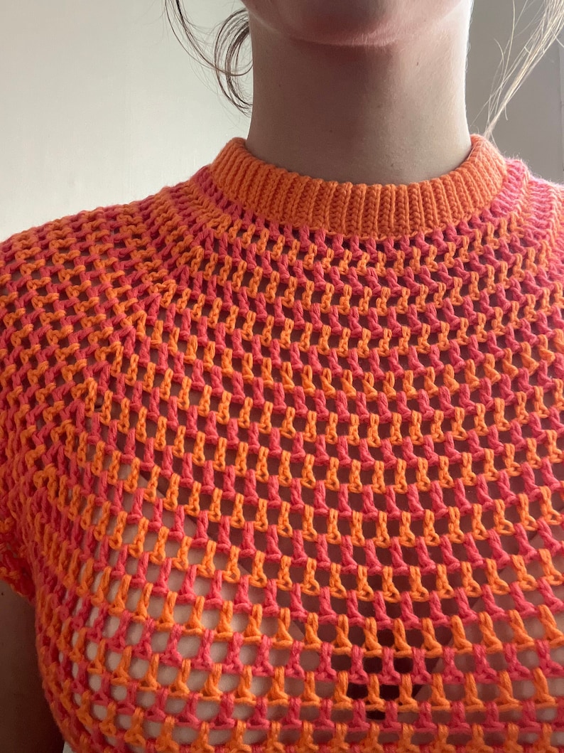 Trendy made to measure summer crochet mesh top. Made with a double folded collar and a raglan sleeve, this chic, sexy crochet top will be your summer staple.