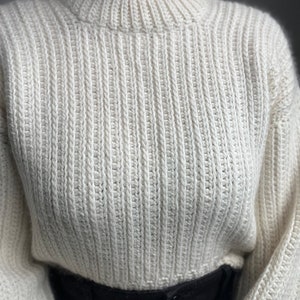 Vintage-inspired beginner-friendly crochet sweater pattern PDF. Uses mock-knit stitches to give a timeless chic look.