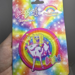 May include: A circular woven patch featuring a graphic of Spongebob Squarepants riding a white unicorn against a rainbow background. The packaging displays the text Lisa Frank X SPONGEBOB and Limited Edition Woven Patch on a colorful starburst background.