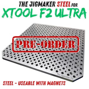 May include: A steel jig plate for the XTool F2 Ultra laser engraver. The plate is silver with numerous small holes and the text "PRE-ORDER" stamped across it. The text "The Jigmaker Steel for XTool F2 Ultra" is at the top, and "STEEL - USEABLE WITH MAGNETS" at the bottom.