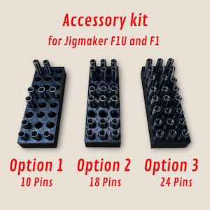 May include: Three black plastic accessory kits for the Jigmaker F1U and F1. The kits contain different numbers of pins: 10 pins, 18 pins, and 24 pins.