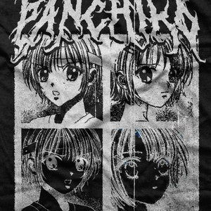 May include: Black and white graphic t-shirt featuring a band name "FANCHIKO" in a stylized font with a grunge aesthetic. The design includes four black and white images of anime-style characters with large eyes. The text "D>E>A>T>H>M>E>T>A>L" is printed at the bottom of the shirt.