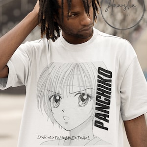 May include: White t-shirt with a black and white anime-style illustration of a girl with large eyes. The text "PANCHIKO" is printed vertically on the right side of the shirt. The text "D>E>A>T>H>M>E>T>A>L" is printed below the illustration.