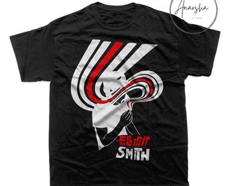 May include: Black t-shirt with a white and red graphic design featuring a silhouette of a person with the text "Elliott Smith" in white letters.