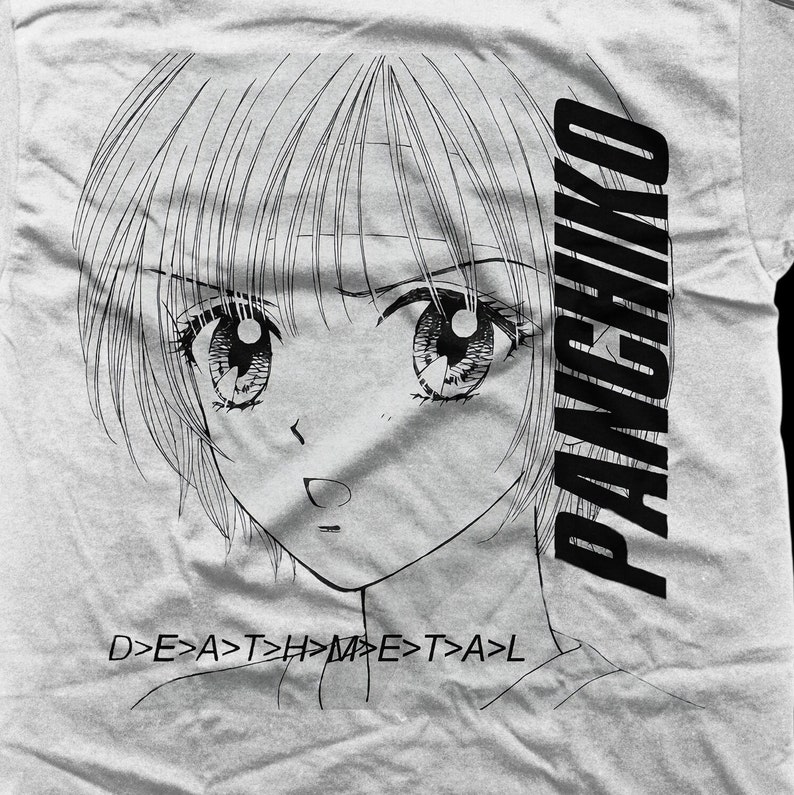 May include: Black and white illustration of a girl with large eyes and short hair. The text "PANCHIKO" is printed vertically on the right side of the image. The text "D>E>A>T>H>M>E>T>A>L" is printed below the girl's face.