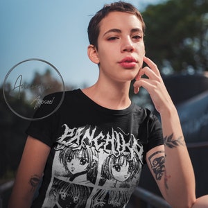 May include: Black t-shirt with a white graphic print of four anime-style faces and the text "P>N>K>C>H>R>W" and "D>E>A>T>H>M>F>>A>" in a gothic font.