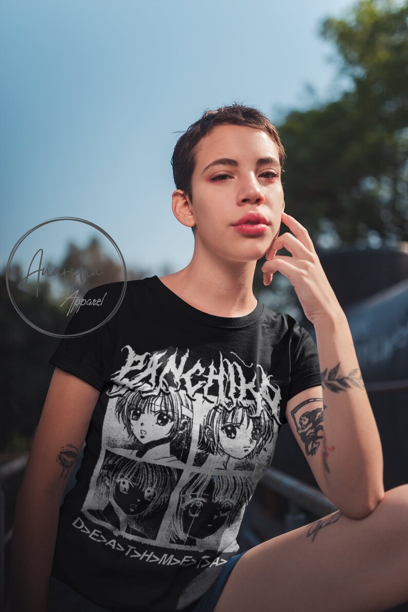 May include: Black t-shirt with a white graphic print of four anime-style faces and the text "P>N>K>C>H>R>W" and "D>E>A>T>H>M>F>>A>" in a gothic font.