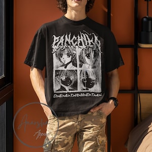 May include: A black t-shirt with a graphic print of four anime characters in white. The text "PANKCHILEN" is printed in white above the characters. The text "D>E>A>T>H>M>E>T>A>" is printed in white below the characters.