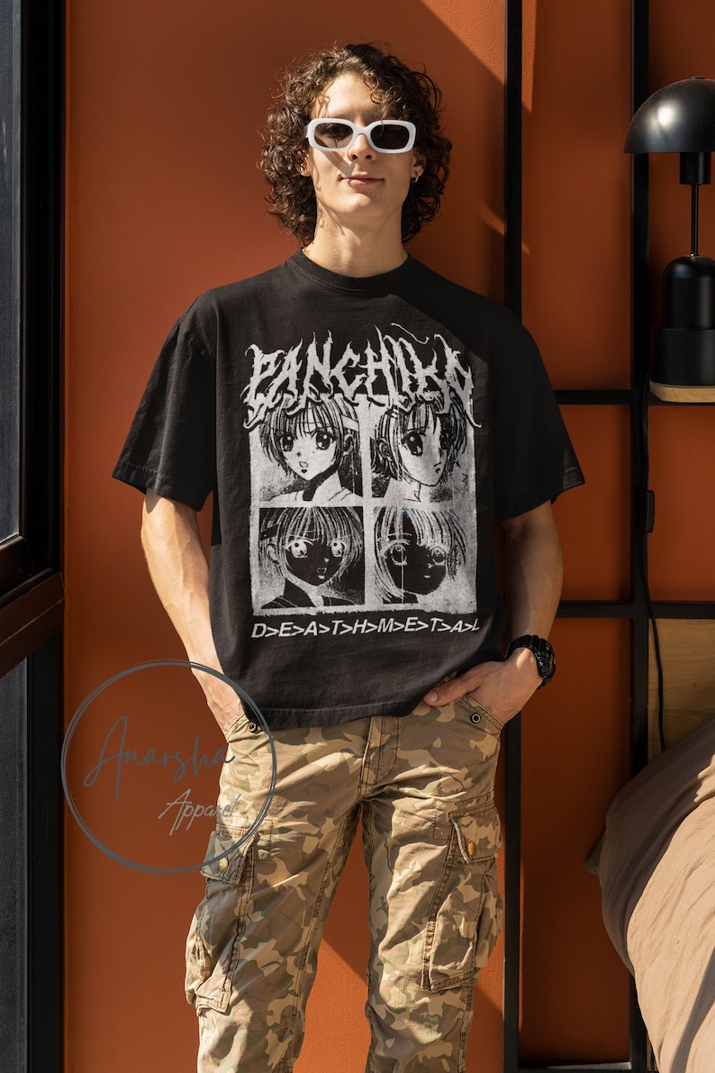 May include: A black t-shirt with a graphic print of four anime characters in white. The text "PANKCHILEN" is printed in white above the characters. The text "D>E>A>T>H>M>E>T>A>" is printed in white below the characters.