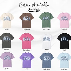 May include: A collection of Comfort Colors 1717 t-shirts in various colors, including ivory, espresso, light green, and blossom. Each shirt features the word "MAMA" in a floral design, with "EST 2023" below. The available colors are displayed.