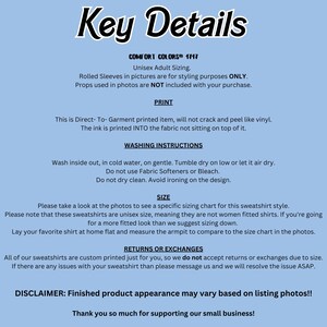 May include: A light blue graphic with the words "Key Details" in a stylized font. The text provides information about the product, including washing instructions, sizing, and return policies. The text also mentions the product is unisex.