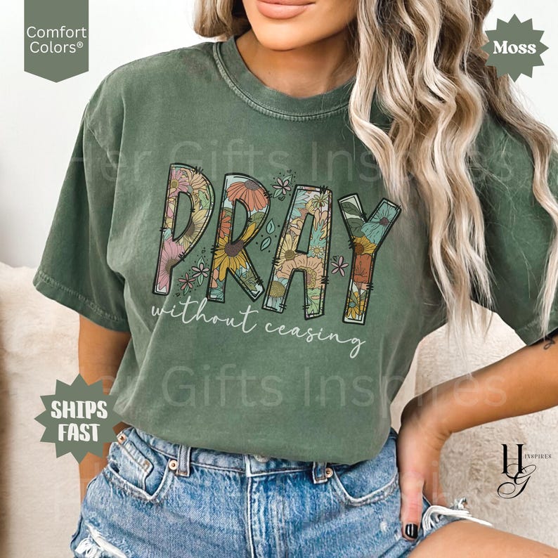 May include: A moss green t-shirt with the word "PRAY" in a floral design, and the words "without ceasing" below. The shirt is a Comfort Colors brand.