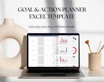 Könnte beinhalten: Ein Laptop-Computer zeigt eine Tabellenkalkulation mit Diagrammen und Grafiken. Die Tabellenkalkulation trägt den Titel "Goal & Action Planner Excel Template". Der Text "www.etsy.com/shop/MsPlannerStudio" wird unter dem Titel der Tabellenkalkulation angezeigt.