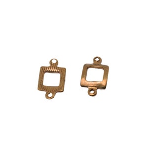 May include: Two bronze-colored rectangular connector charms with a square cutout in the center. Each charm has two small holes at the top and one at the bottom for attaching to other jewelry components.