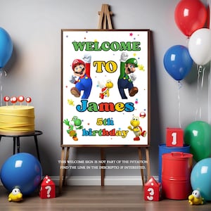 May include: A framed sign on an easel with the words "WELCOME TO James 5th birthday" and cartoon characters. Balloons, a cake, and other party decorations are in the background.