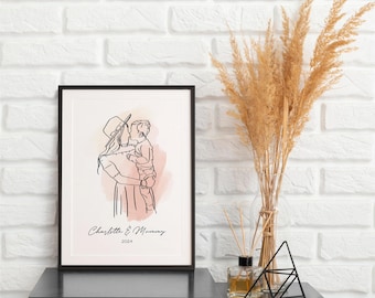 May include: A framed line art print featuring a mother and child in a tender embrace. The artwork is in black lines with a soft pink and peach watercolor wash. The print includes the text "Charlotte & Mommy" and the year "2024".