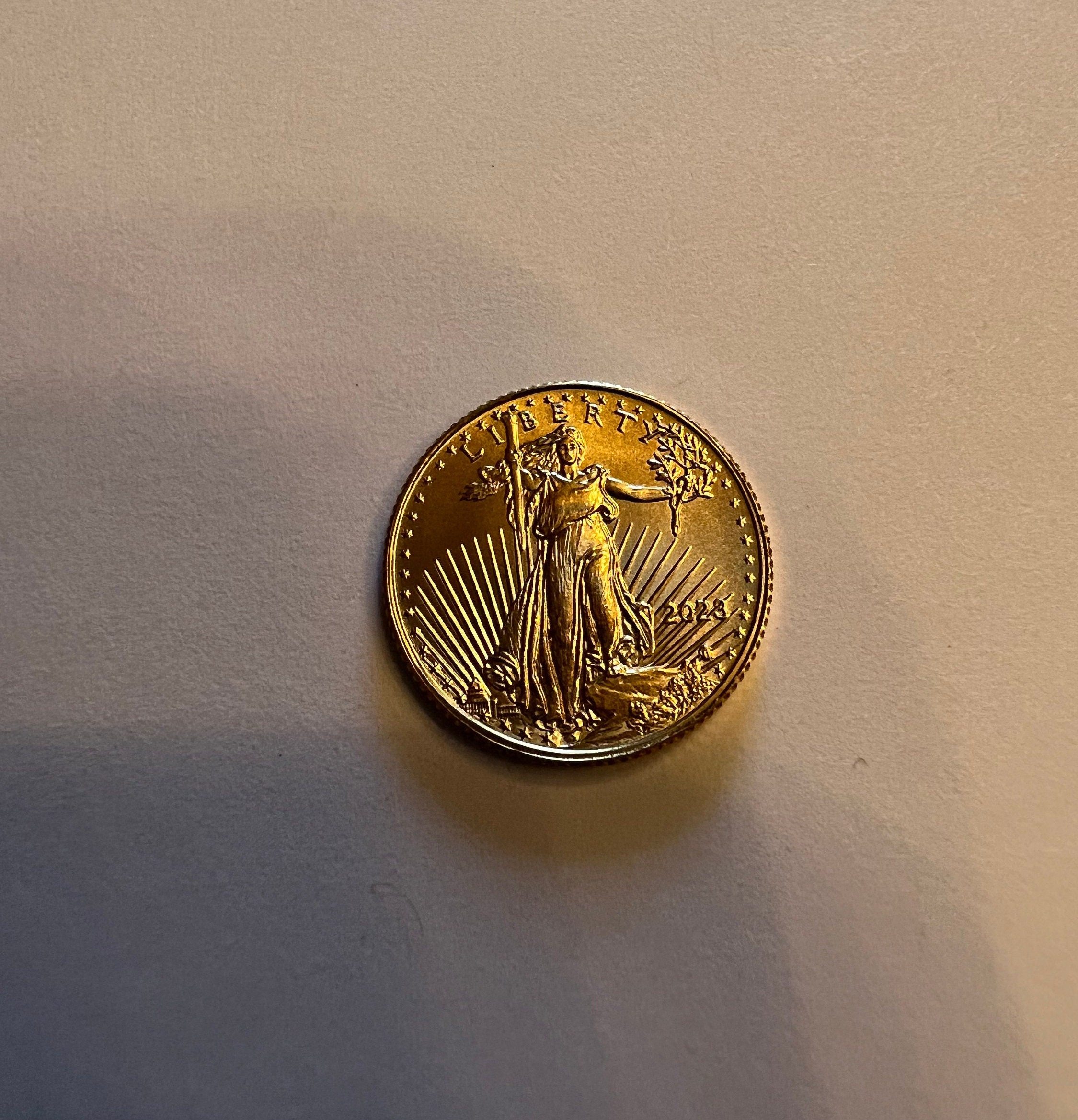 Coin Ping Test - British Sovereign vs 1/4 American Gold Eagle. Is it the  Silver? I think so. 