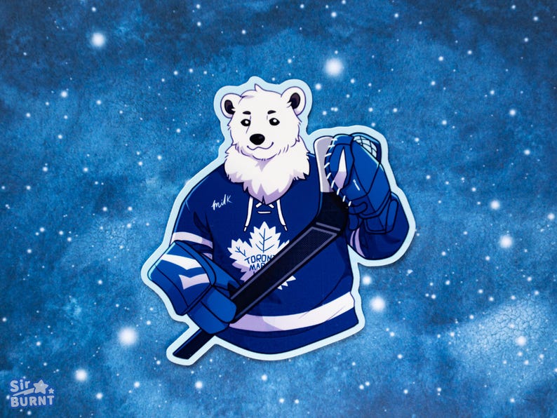 May include: A sticker featuring a cartoon polar bear wearing a blue hockey jersey with a white maple leaf logo. The bear is holding a hockey stick and wearing blue gloves. The background is a blue gradient with white stars.