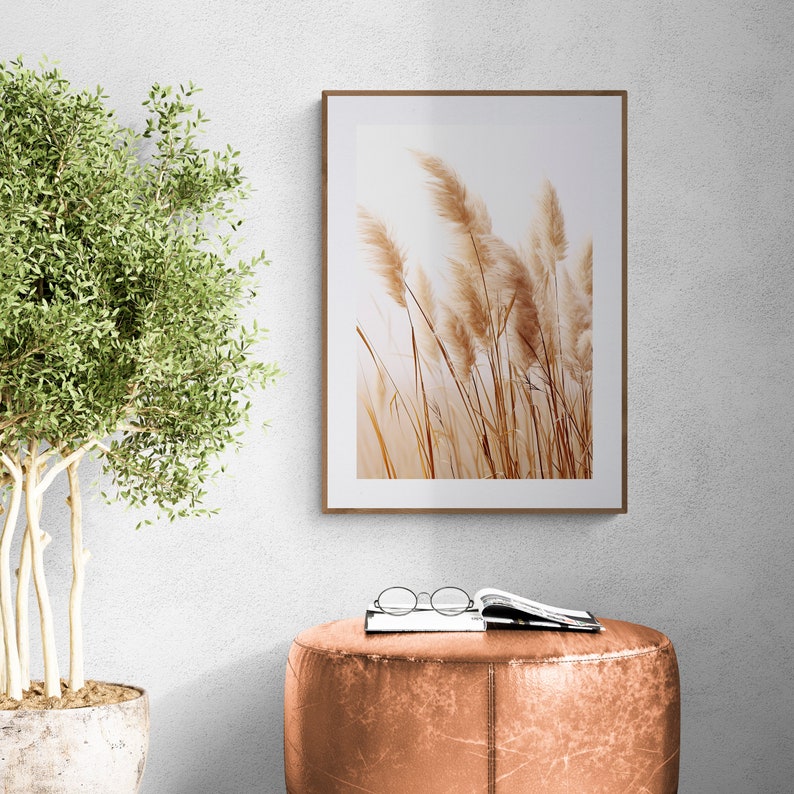 Dry Pampas Grass Neutral Wall Art Set of 3 over a leather pouf and floor plant