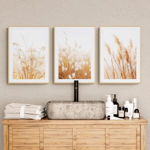 Dry Pampas Grass Neutral Wall Art Set of 3 over a bathroom cabinet with stone basin