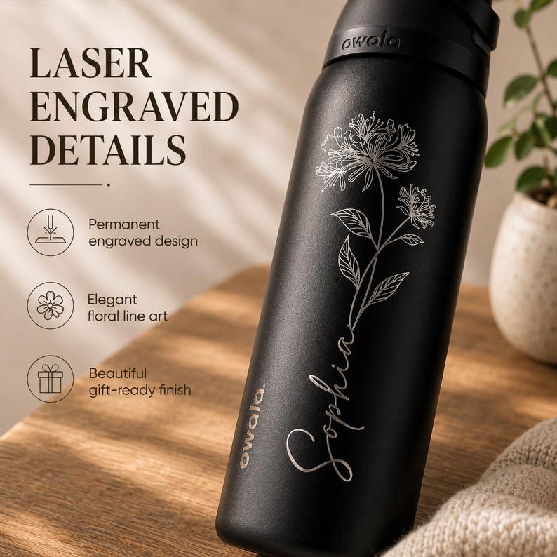 May include: A black Owala water bottle with laser-engraved floral details and the name "Sophia." The bottle has a permanent engraved design and a gift-ready finish. The text "LASER ENGRAVED DETAILS" is visible.