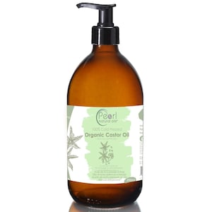 May include: A brown glass bottle with a pump dispenser containing 250 ml of organic castor oil. The label is white with green accents and features the text "Pearl natural oils" and "100% Cold Pressed Organic Castor Oil".