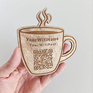 May include: Wooden coffee cup with a QR code and the text "Your Wifi Name" and "Your Wifi Pass".