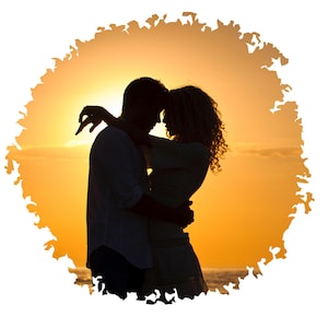May include: Silhouette of a couple embracing at sunset, with the sun setting behind them. The couple is standing on a beach with the ocean in the background.