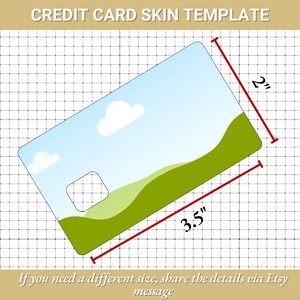 Peut inclure: Mod&egrave;le de skin pour carte de cr&eacute;dit avec un paysage. Le skin mesure 8,89 cm sur 5,08 cm. Le design pr&eacute;sente un ciel bleu avec des nuages et des collines vertes. Le texte en haut indique "CREDIT CARD SKIN TEMPLATE".