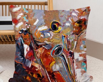 May include: A colorful pillow featuring a painting of two musicians playing instruments. The musician on the left is playing a bass, and the musician on the right is playing a trumpet. The painting is done in a loose, expressive style with bold colors and brushstrokes.