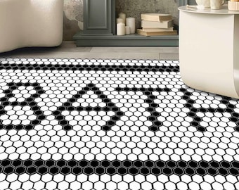 Pode incluir: Azulejos hexagonales de chão preto e branco com uma borda preta. Os azulejos são dispostos em um padrão repetitivo.