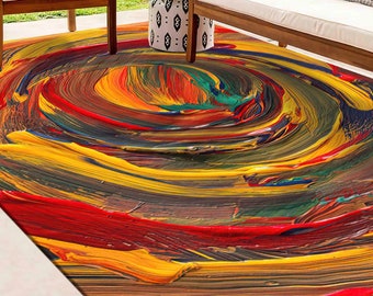 May include: Abstract area rug with a swirling pattern of yellow, red, green, and brown paint.