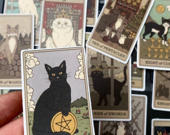 May include: A black cat tarot card with a pentagram on a gold coin. The card is titled "Ace of Pentacles".