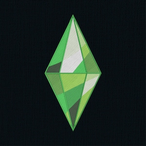 May include: Embroidered green diamond shape with various shades of green, white, and grey on a black background. The diamond is a stylized geometric design, likely a logo or emblem.