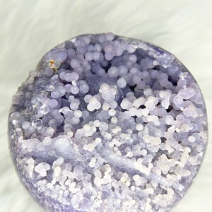 Massive Indonesian grape agate orb. Vivid purple crystal sphere with raw druzy pocket. Spiritual growth aid, energy amplifier. Rare mineral specimen for collectors and enthusiasts.