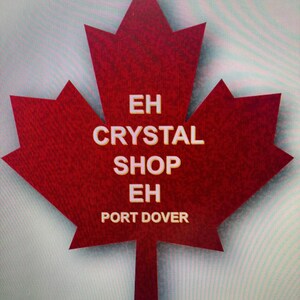May include: A red maple leaf with the text "EH CRYSTAL SHOP EH PORT DOVER" in white.