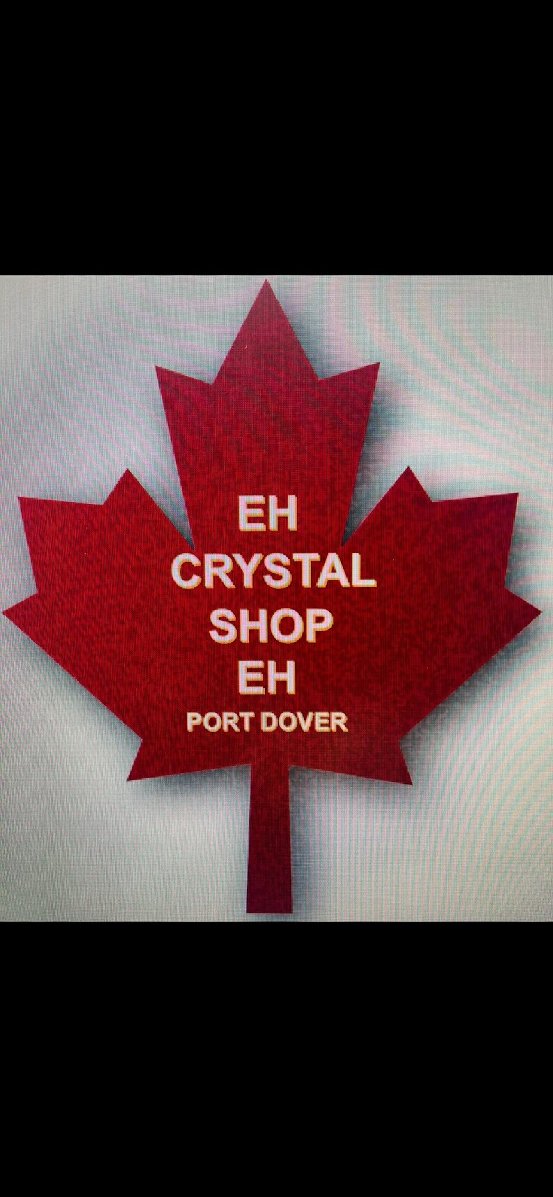 May include: A red maple leaf with the text "EH CRYSTAL SHOP EH PORT DOVER" in white.
