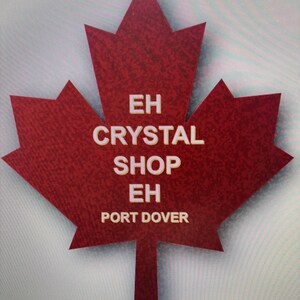 May include: A red maple leaf with the text "EH CRYSTAL SHOP EH PORT DOVER" in white.